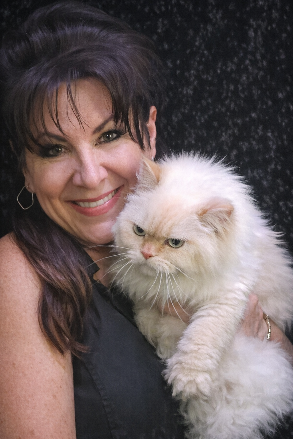 Tracey holding a beautiful white Persian cat - Cat grooming expert at Vanity Fur Pet Parlor Cumming GA